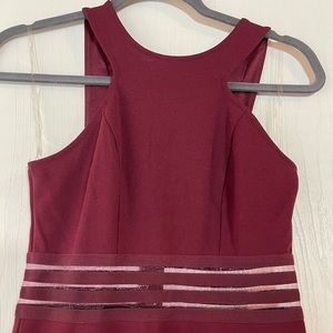 Short dress with cute sheer detail on waist area. New with no tags.